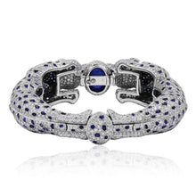 CARTIER Platinum, Diamond and Sapphire Two Panther Head Bangle