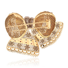 VAN CLEEF & ARPELS  18K Yellow Gold, Diamond and Ruby Bow Brooch